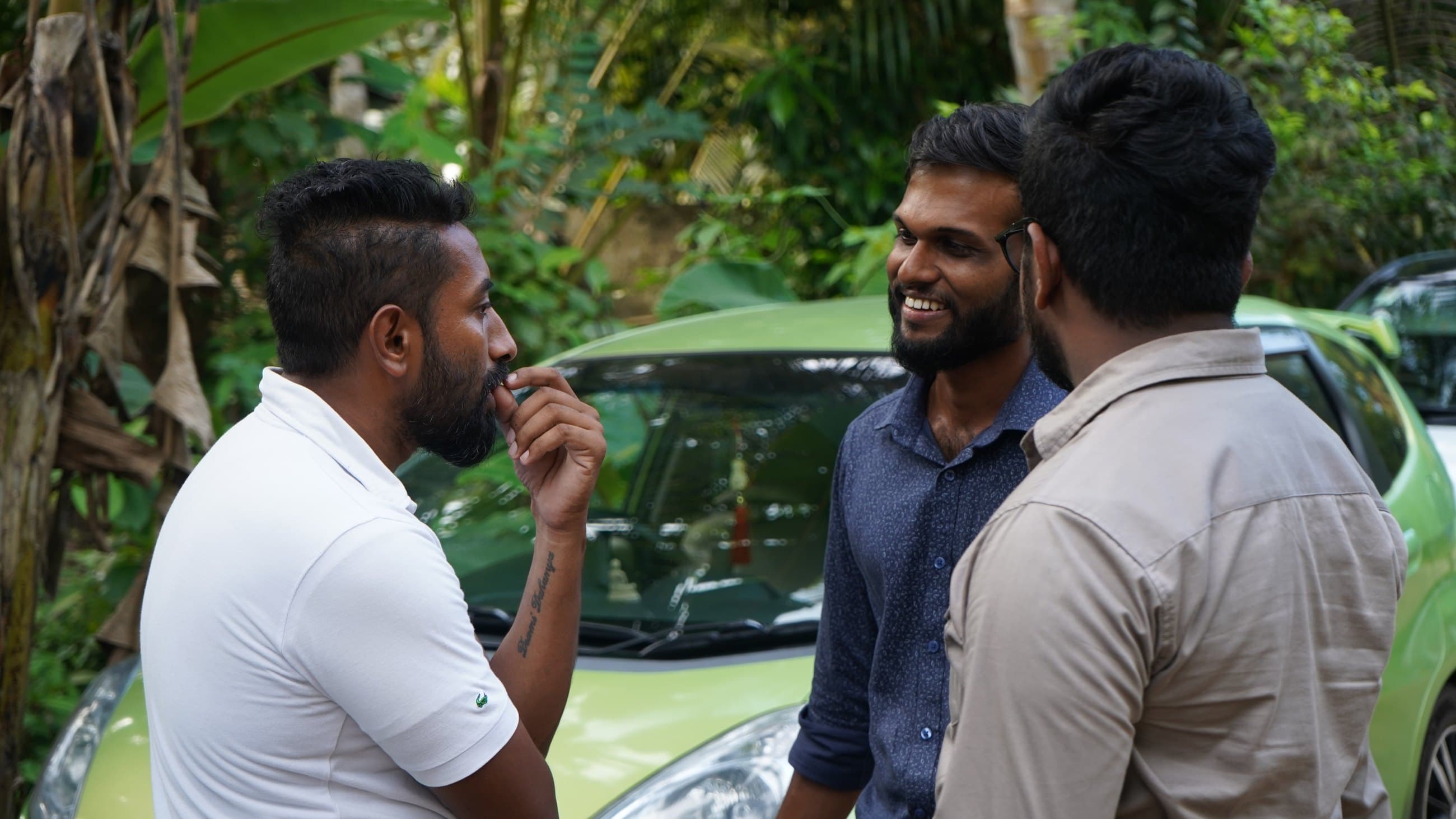 NRC team members in conversation, smiling.